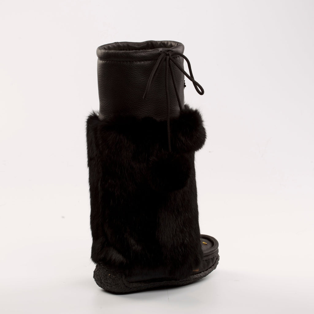 Black mukluk boots with fur trim on a white background