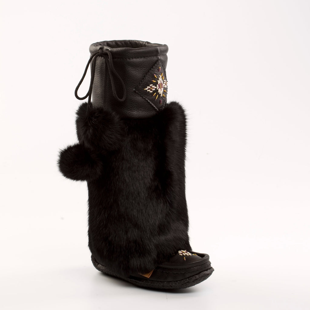 Black Mukluks with fur trim on a white background