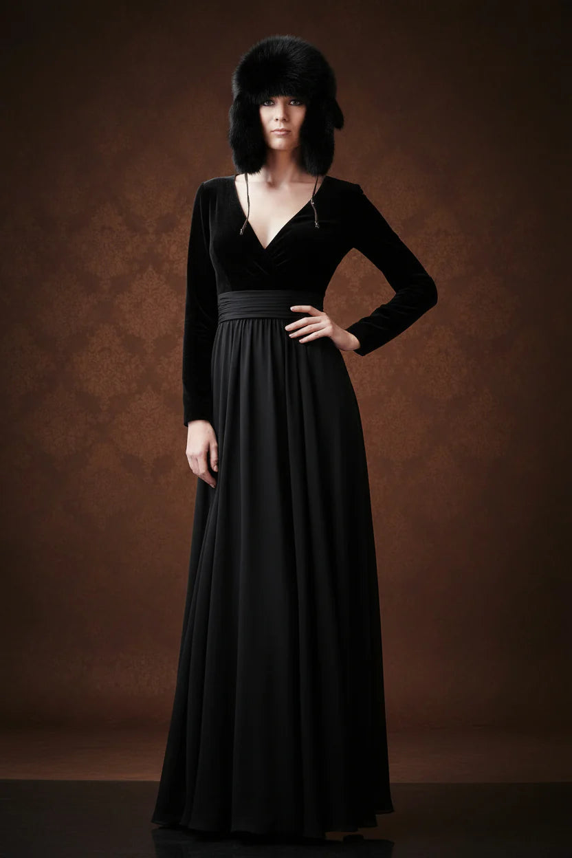 Woman wearing a black dress and hat against a brown background