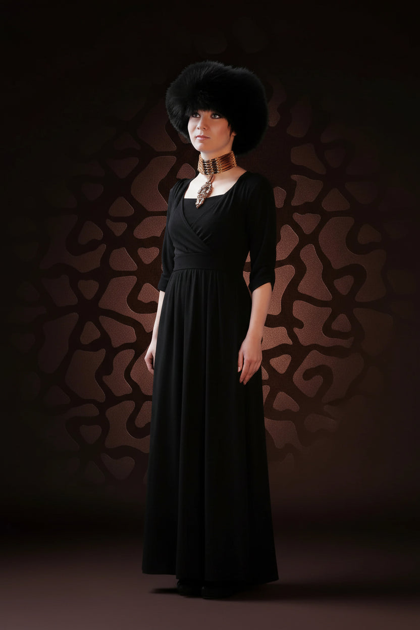 Woman wearing a black dress with a patterned background