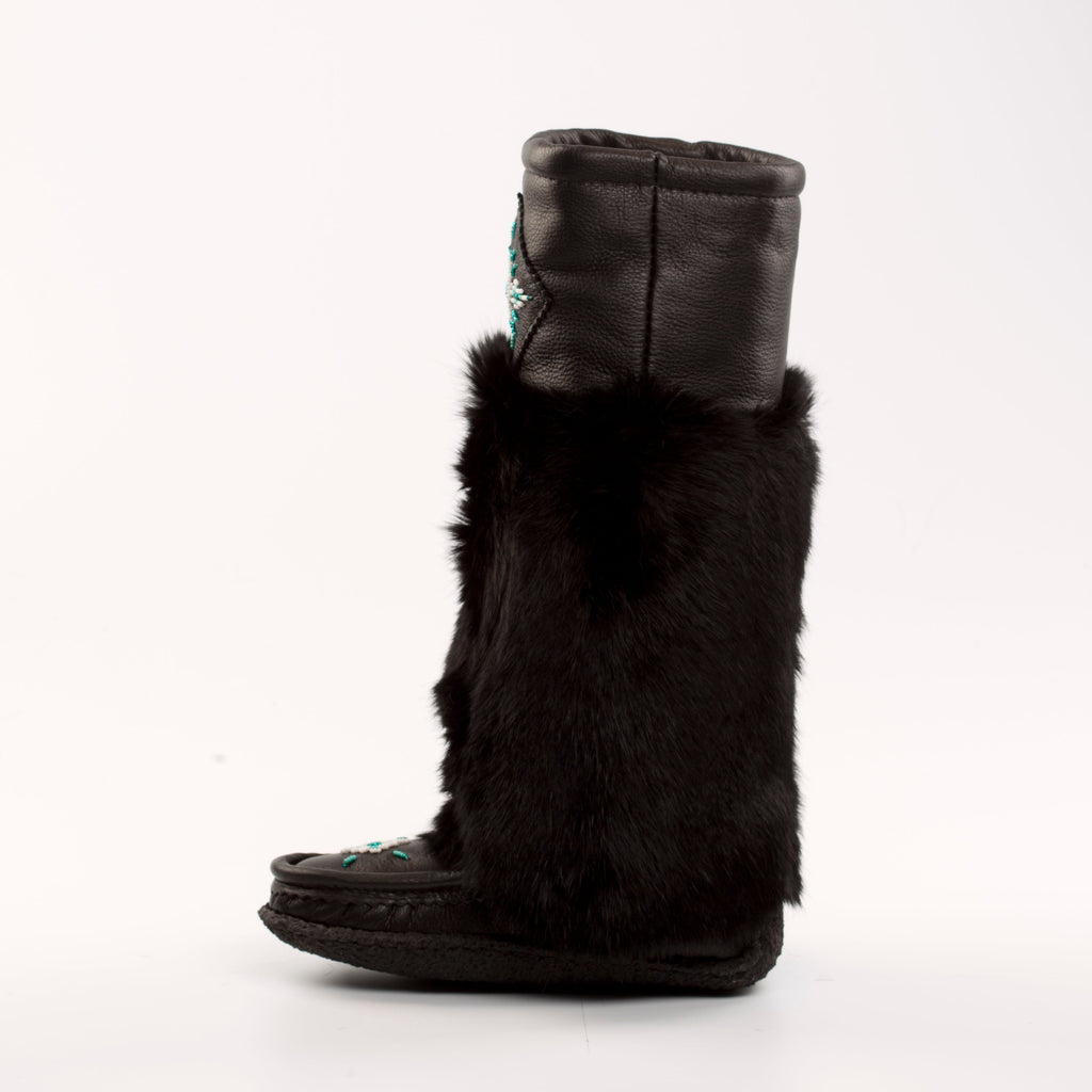 Black mukluk boot with fur cuff on a white background