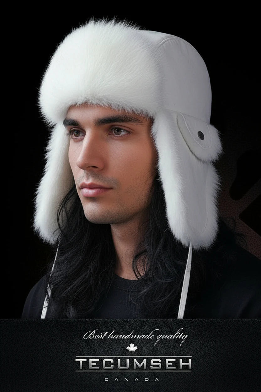 Man wearing a white fur hat with a black background and 'Tecumseh Canada' branding.