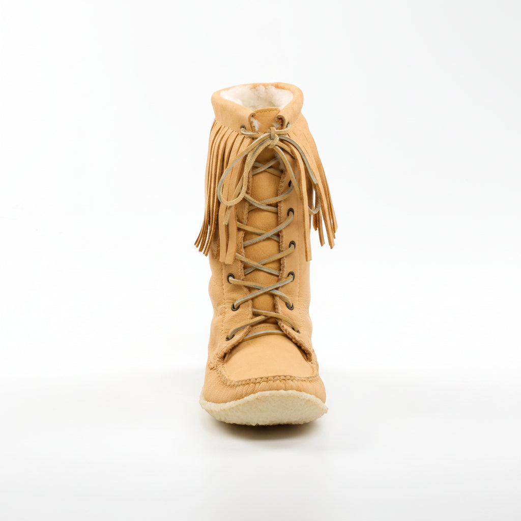 Tan fringed boot on a white background