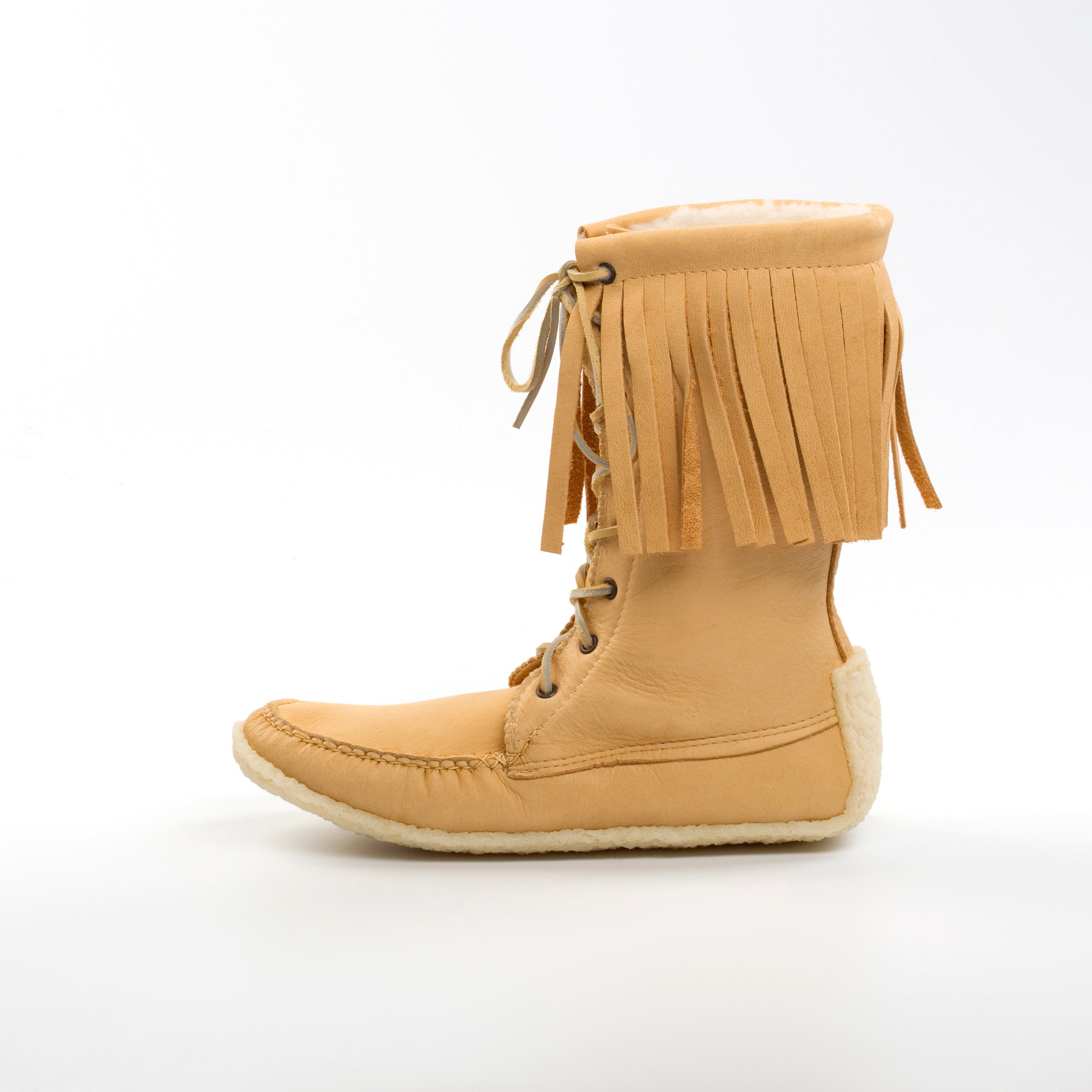 Tan fringed boot on a white background