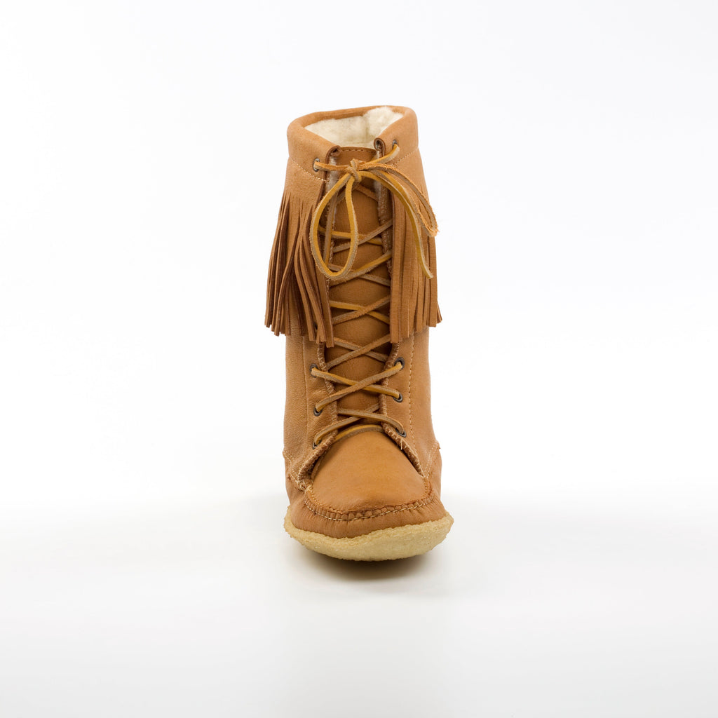 Tan lace-up boot with fringes on a white background