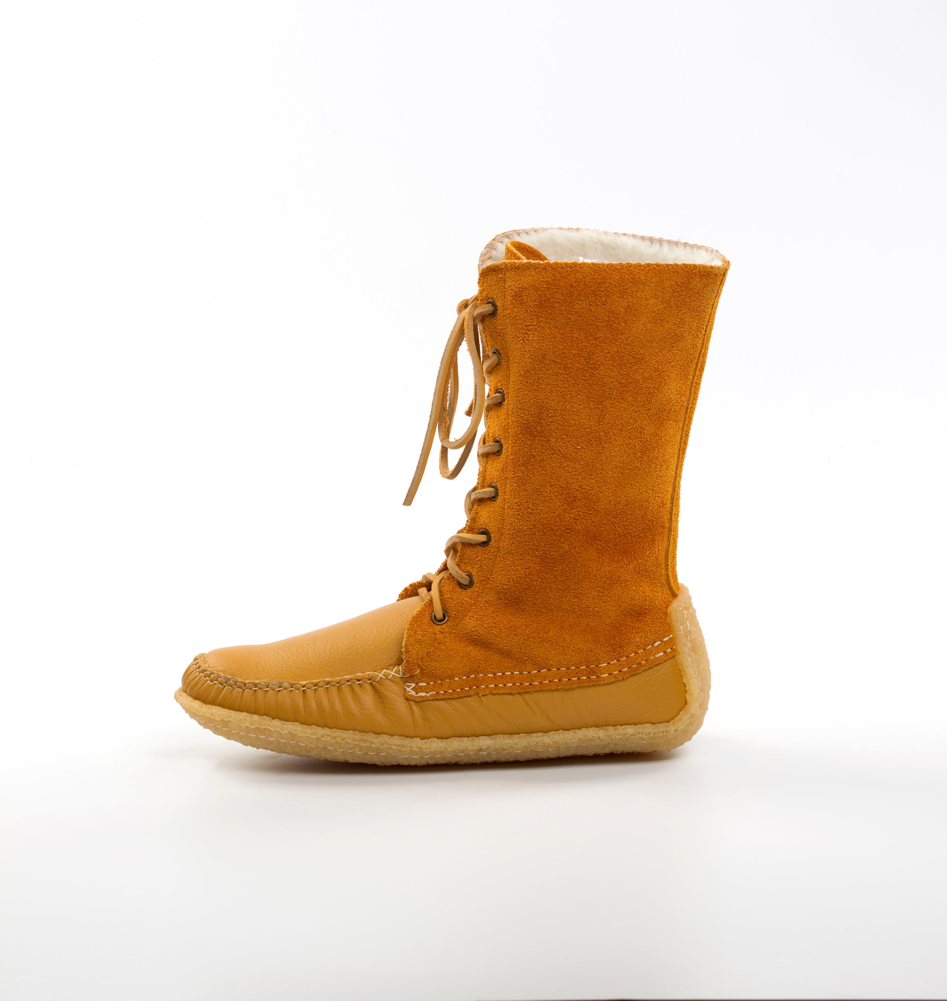 Tan boot with white lining on a white background