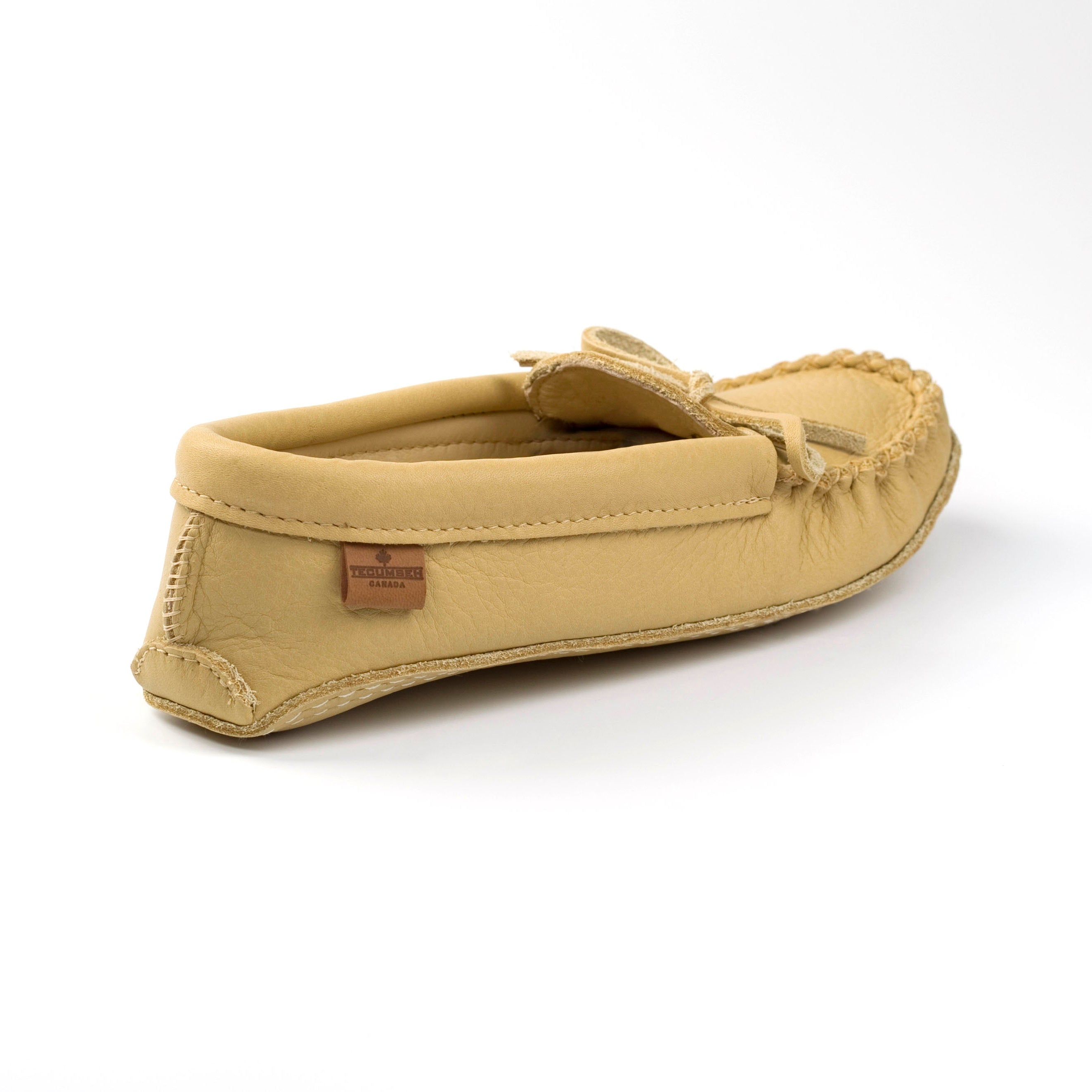 Deer Tan mens moccasins slipper on a white background