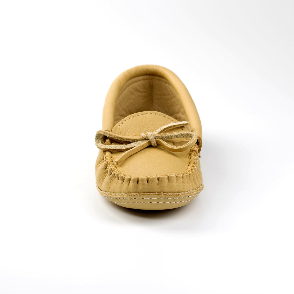 Tan mens moccasin shoe with a bow on a white background