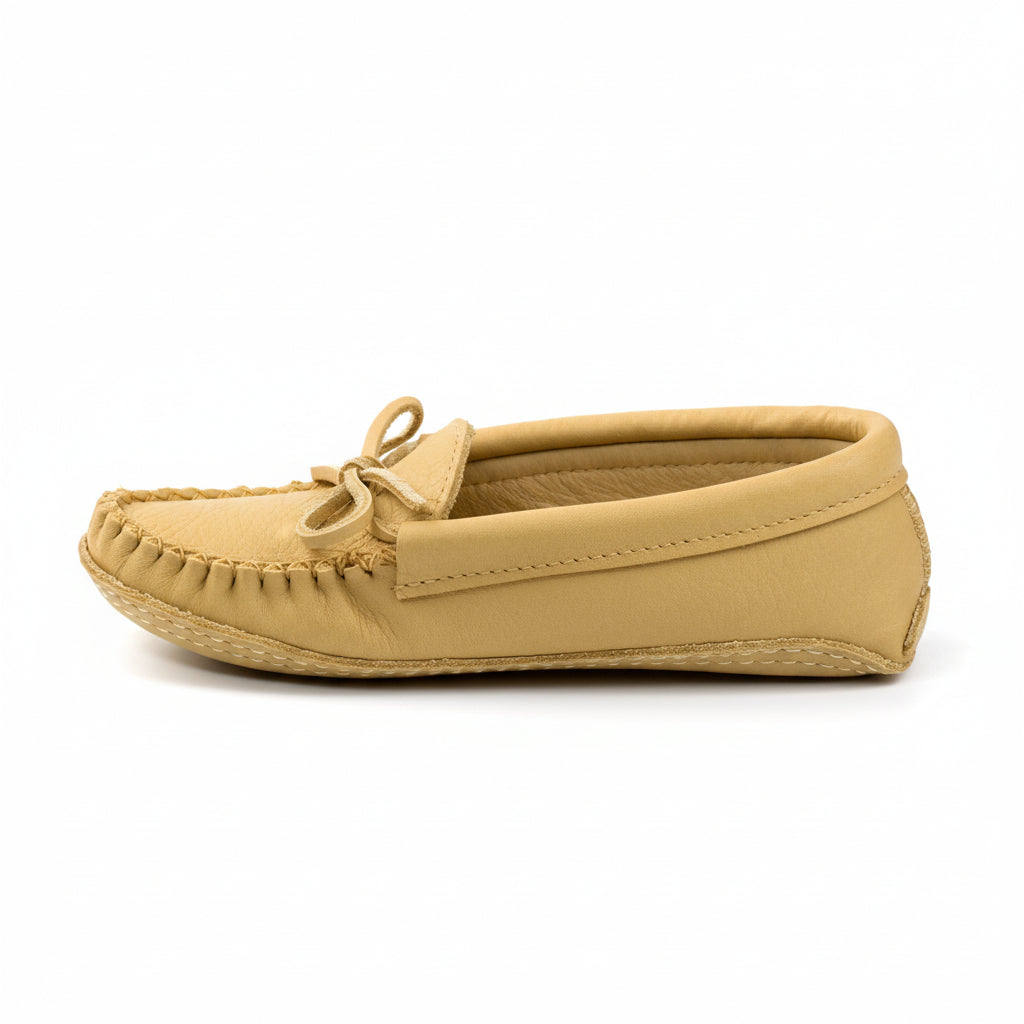 Beige moccasin shoe on a white background