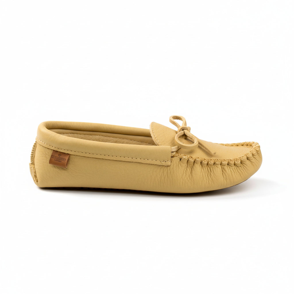 Beige moccasin slipper on a white background