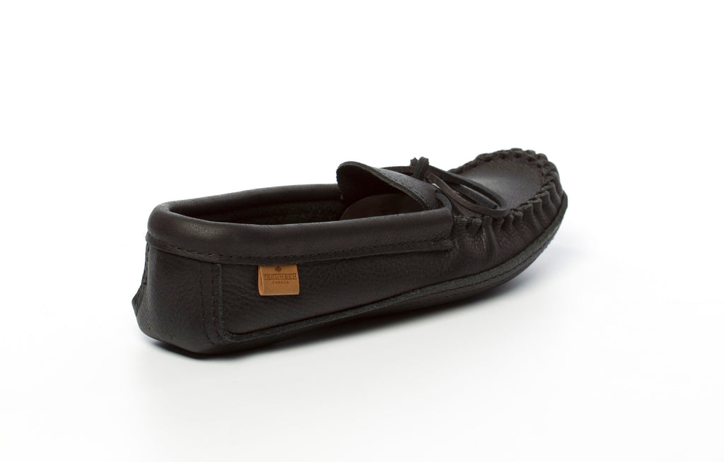 Black moccasin slipper on a white background