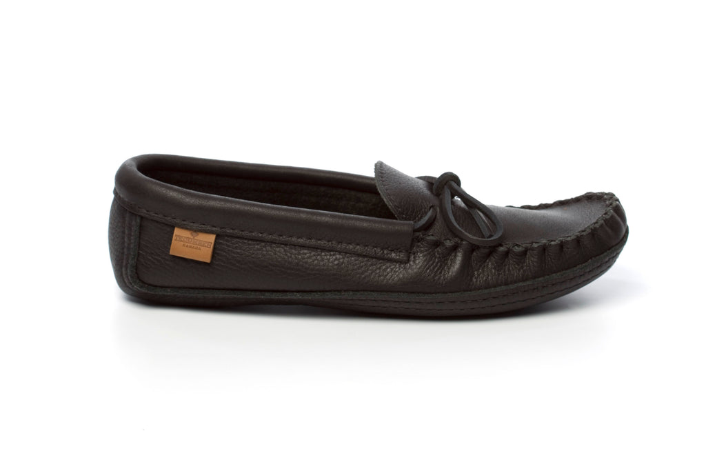 Black leather moccasin shoe on a white background