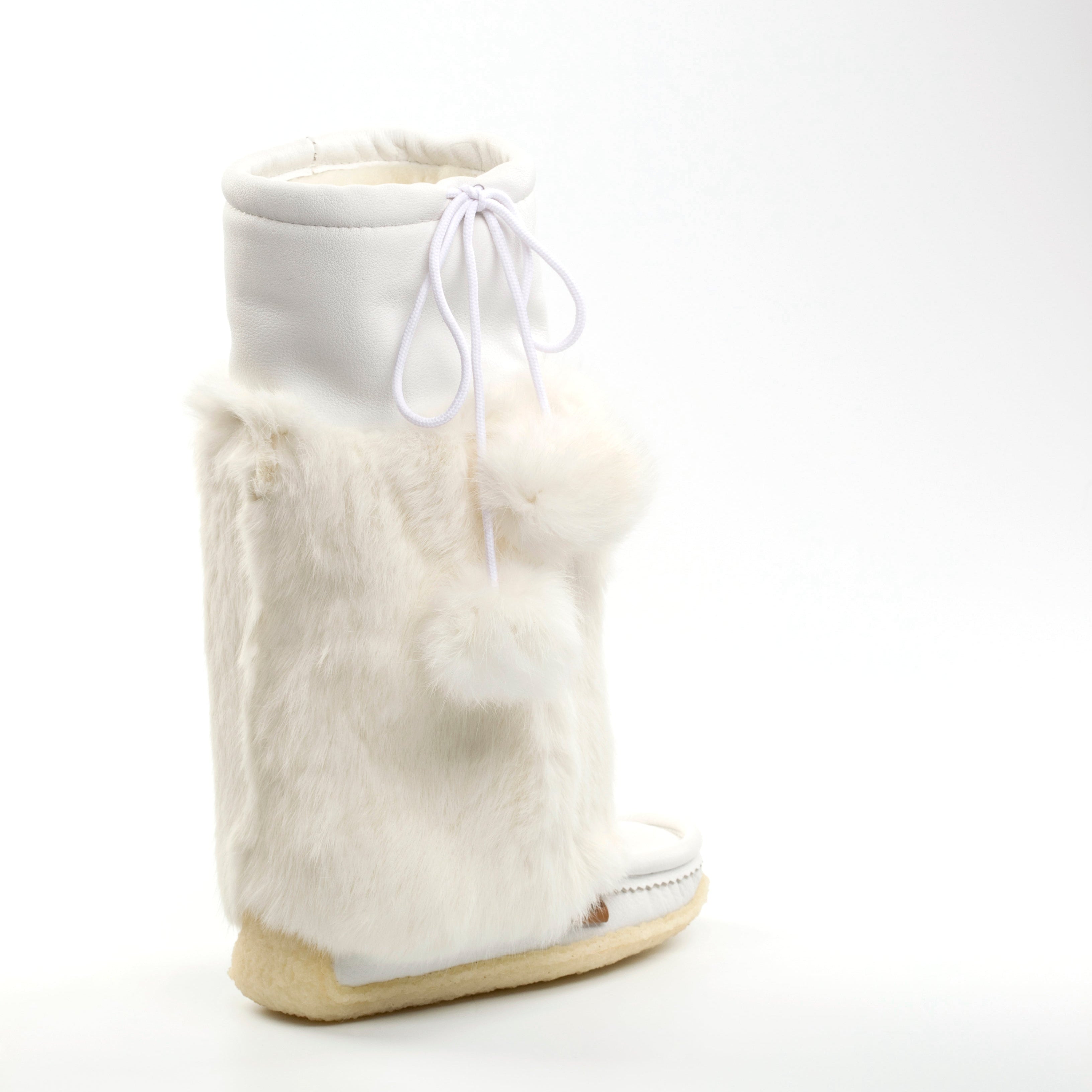 White furry boot with a white sock on a white background