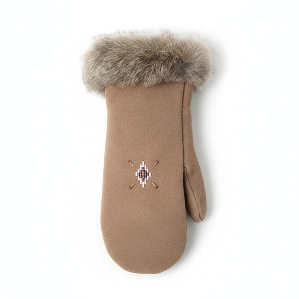 Brown mitten with fur cuff on a green moss background