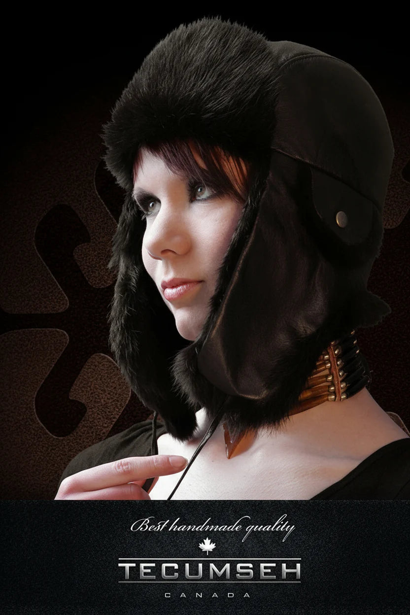 Person wearing a dark fur-lined helmet with 'Tecumseh' branding on a black background