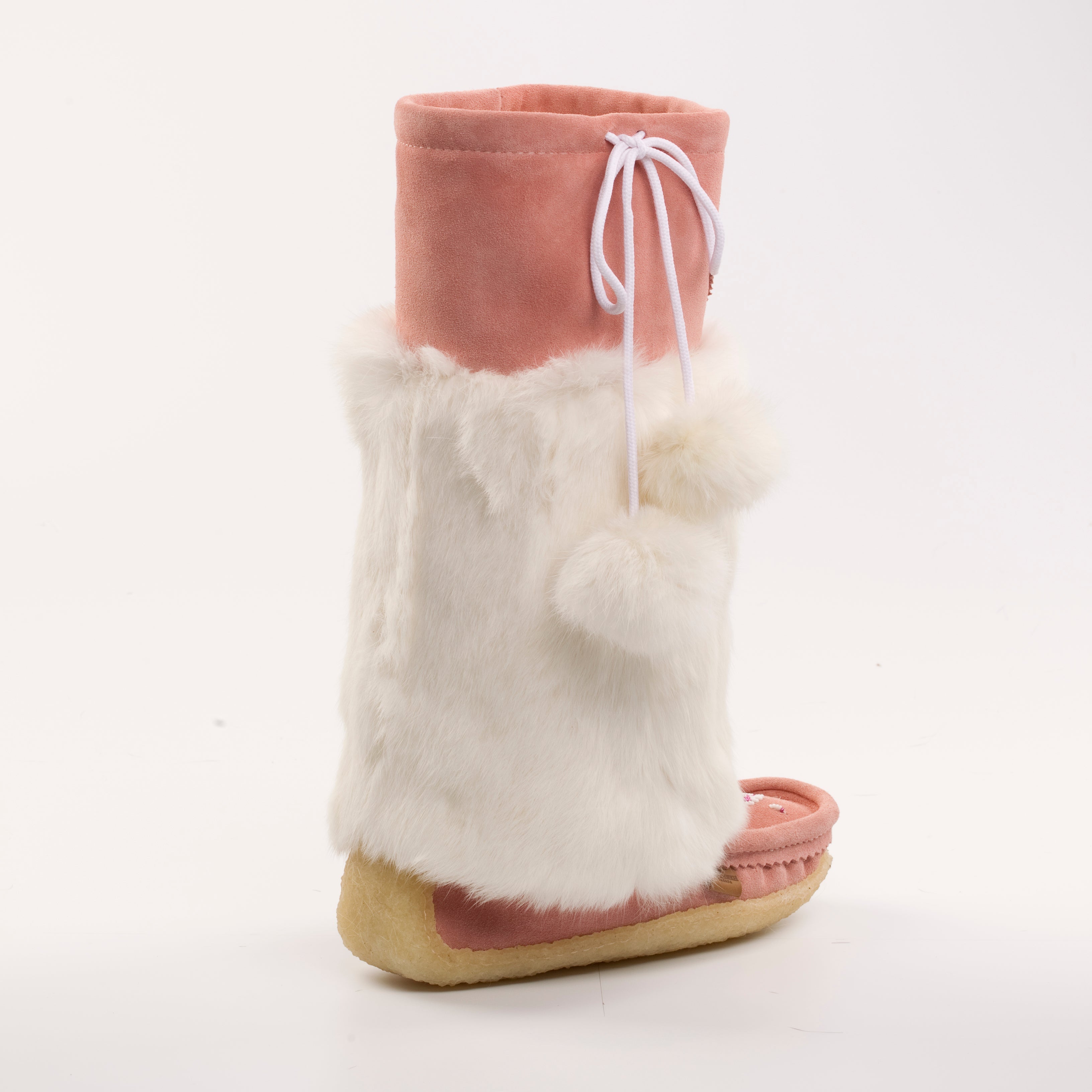 Pink mukluks with white fur trim on a white background