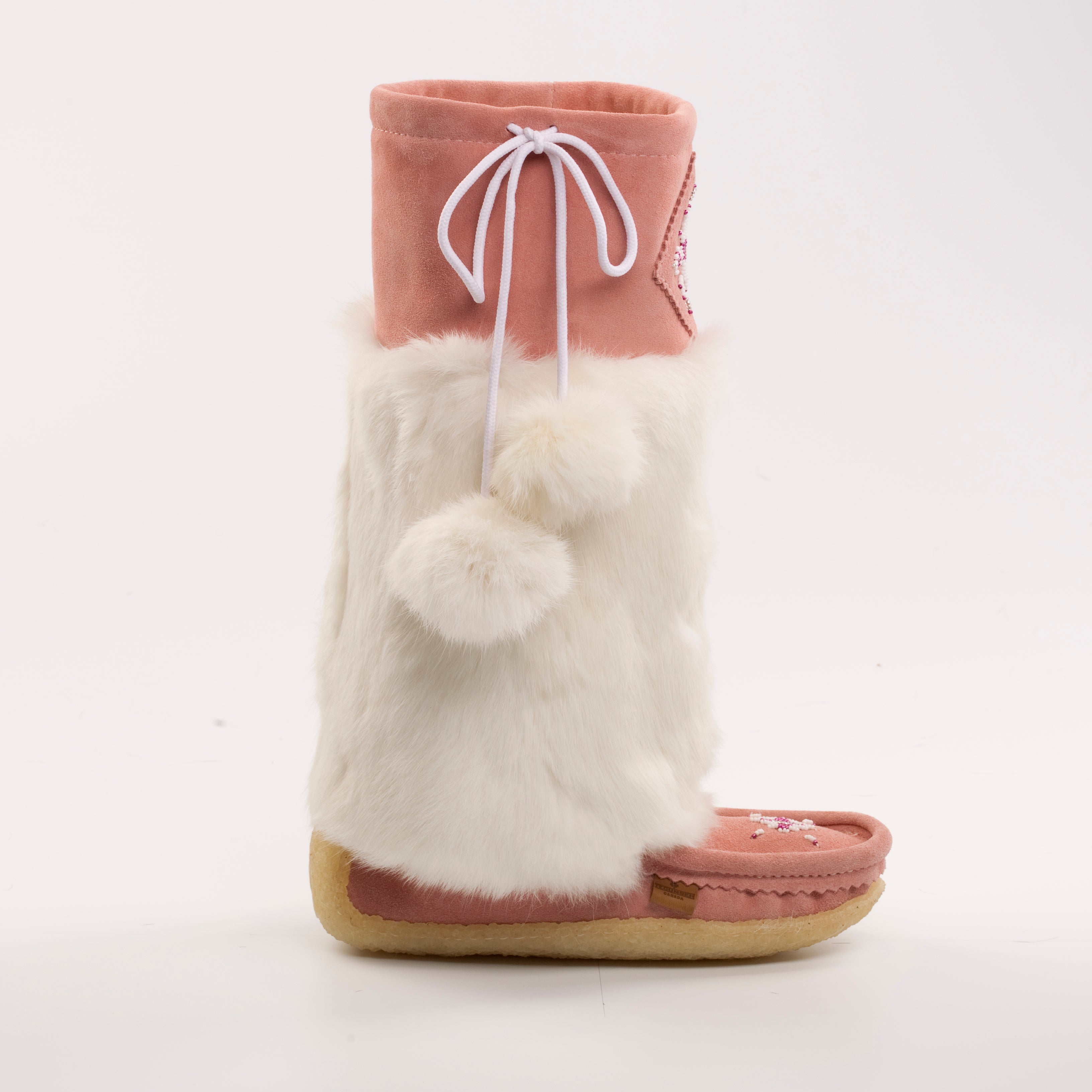 Pink boot with white fur lining on a light gray background mukluks