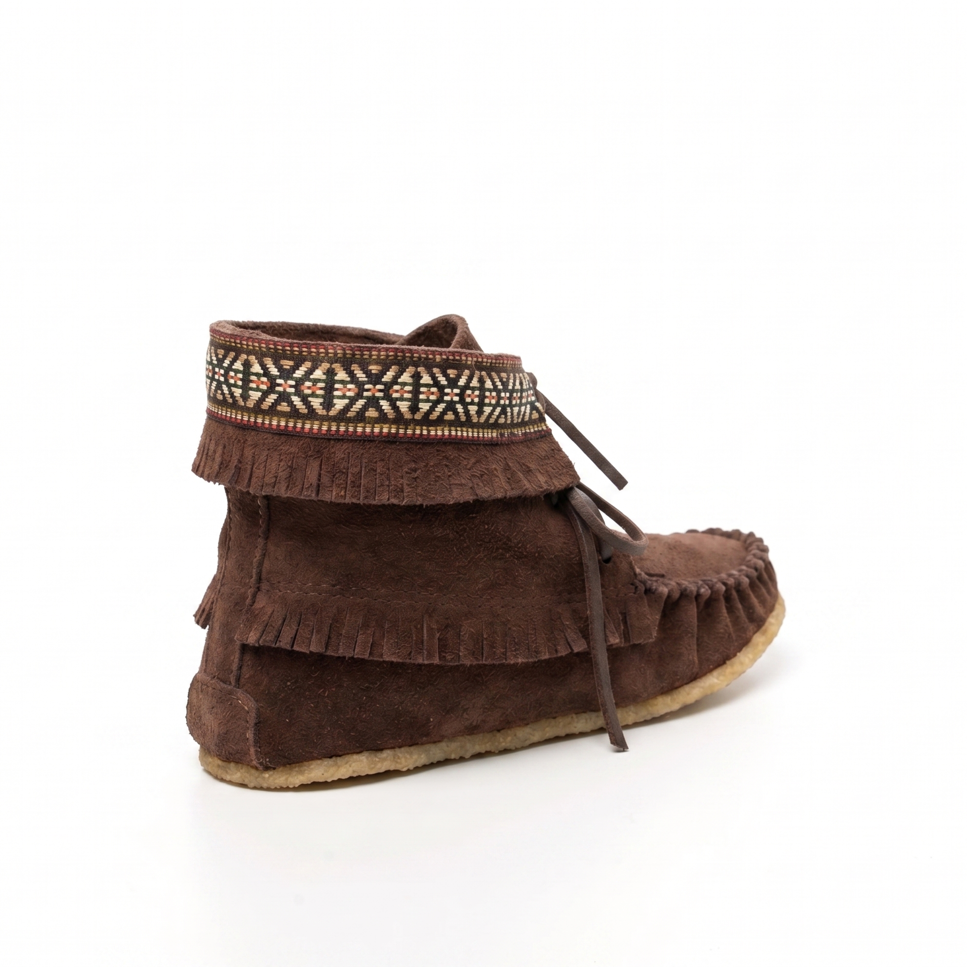 Brown suede moccasin with decorative band on a white background