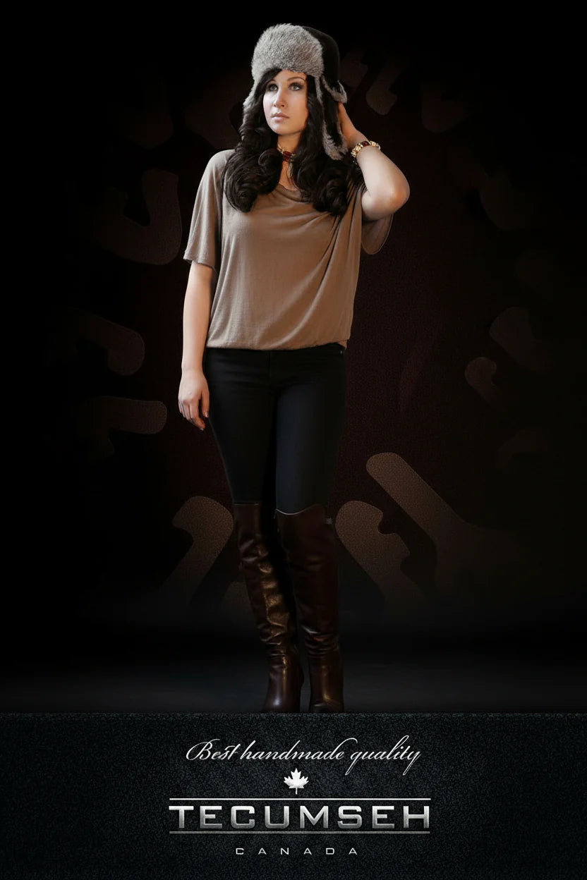 Woman wearing a fur hat and brown boots against a dark background with 'Tecumseh Canada' branding.
