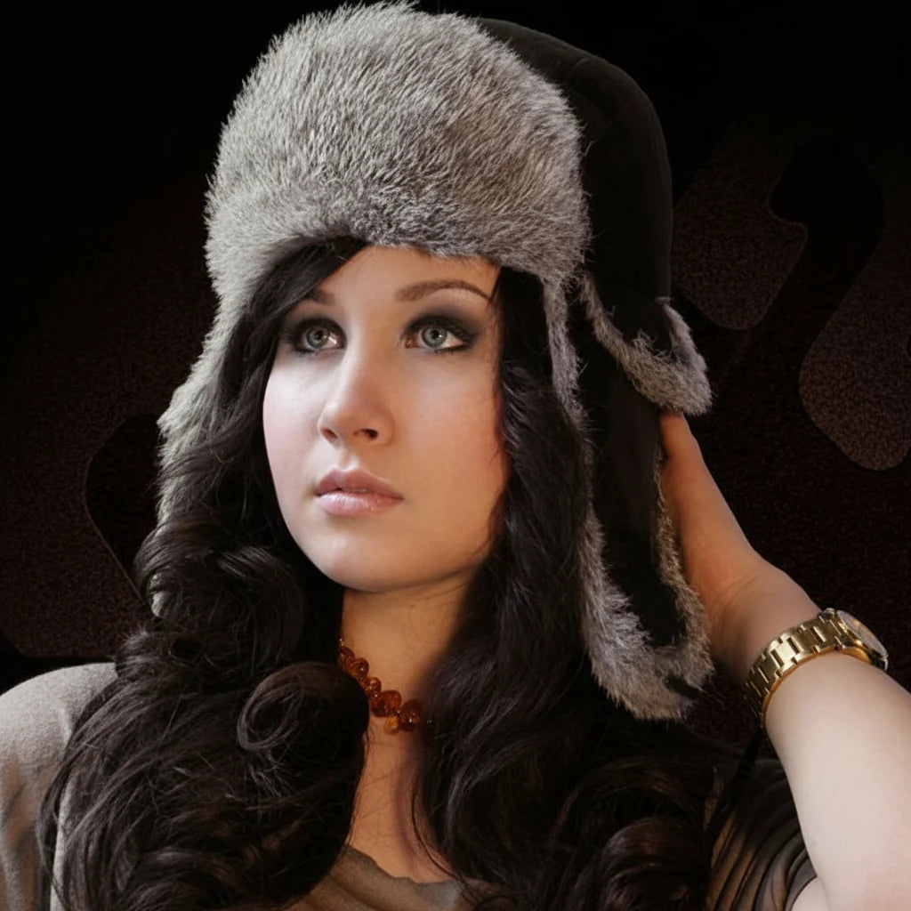 Woman wearing a fur hat against a dark background