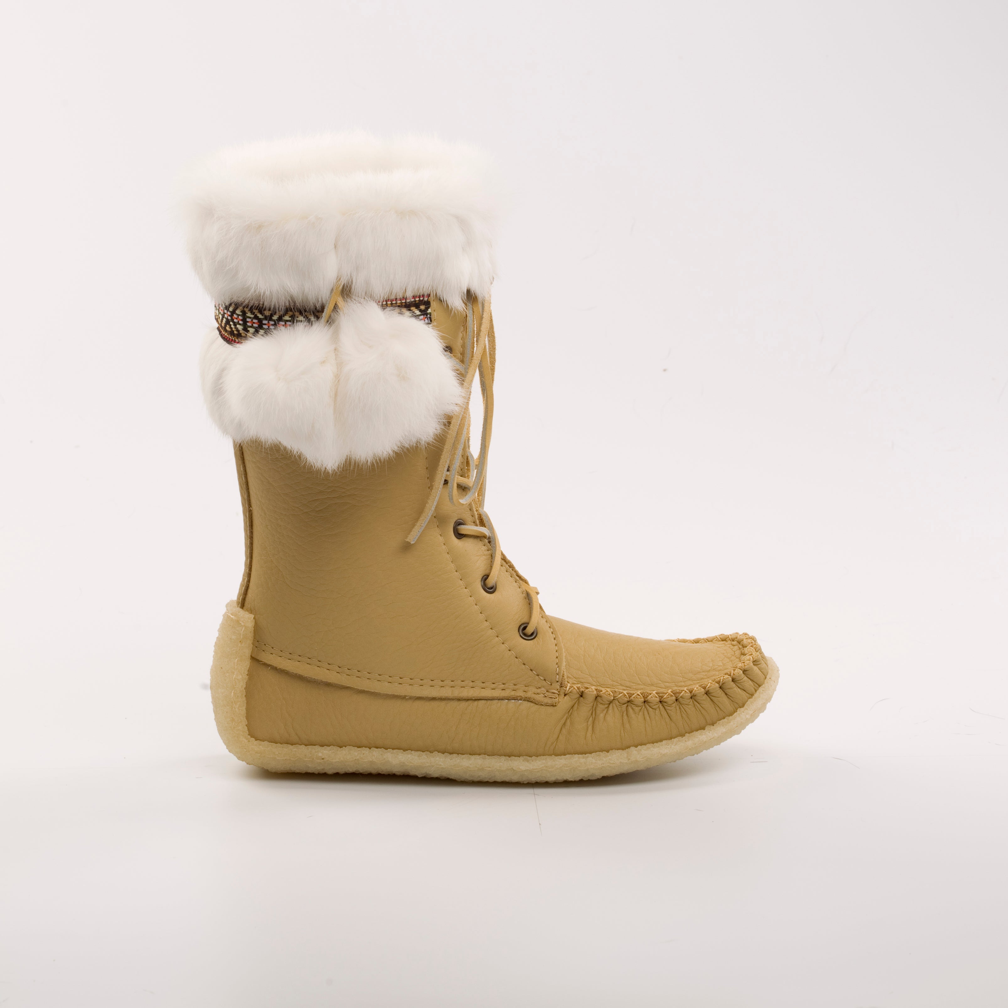 Tan winter boot with white fur lining on a light gray background