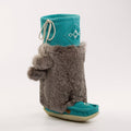 Teal mukluks with gray fuzzy rabbit fur design on a white background