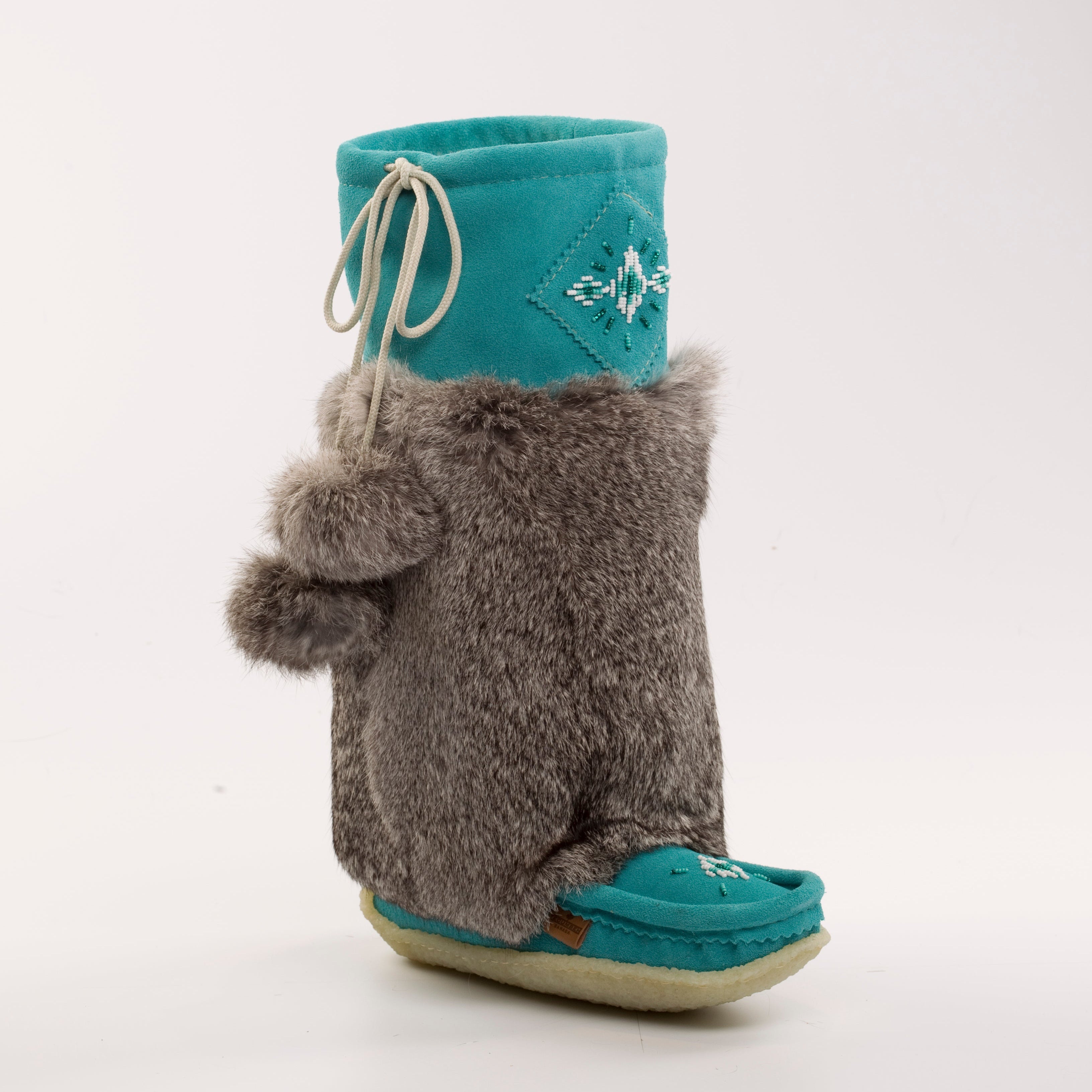 Teal mukluks with gray fuzzy rabbit fur design on a white background