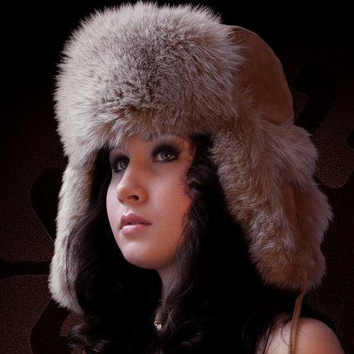 Woman wearing a fur hat against a dark background
