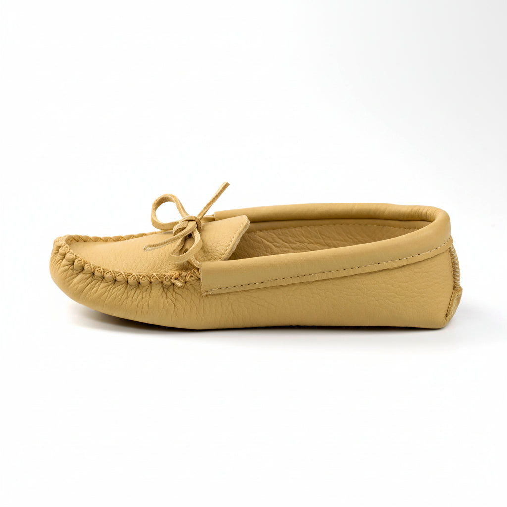 Beige moccasin slipper on a white background