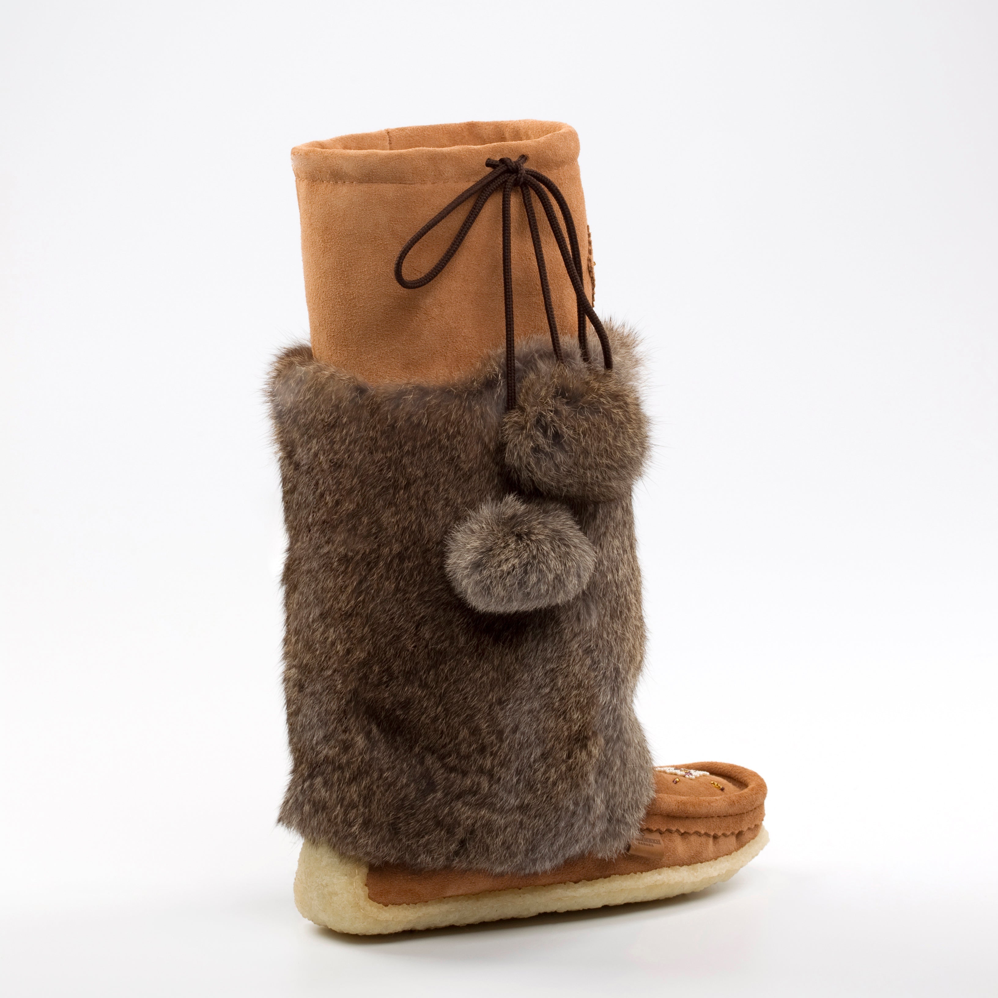 Brown furry boot on a white background