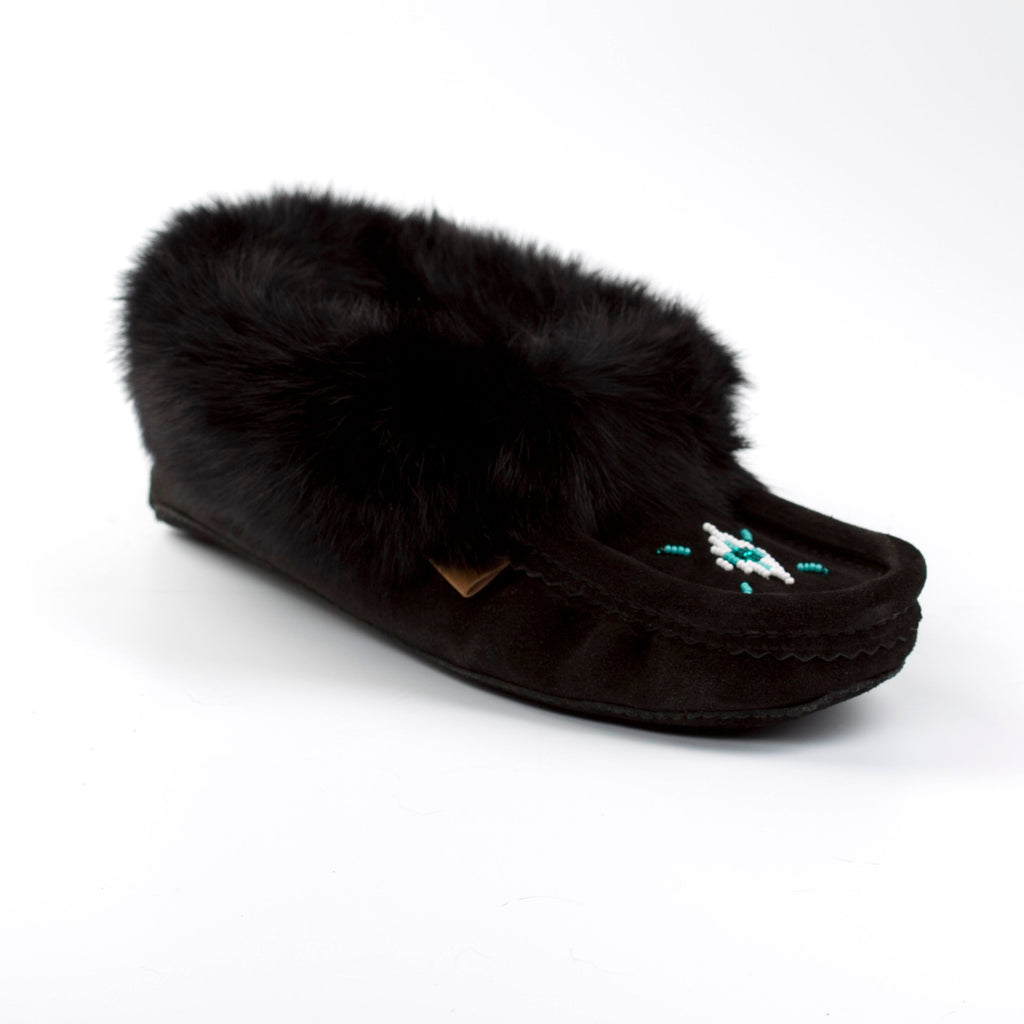 Black slipper with fur on a white background
