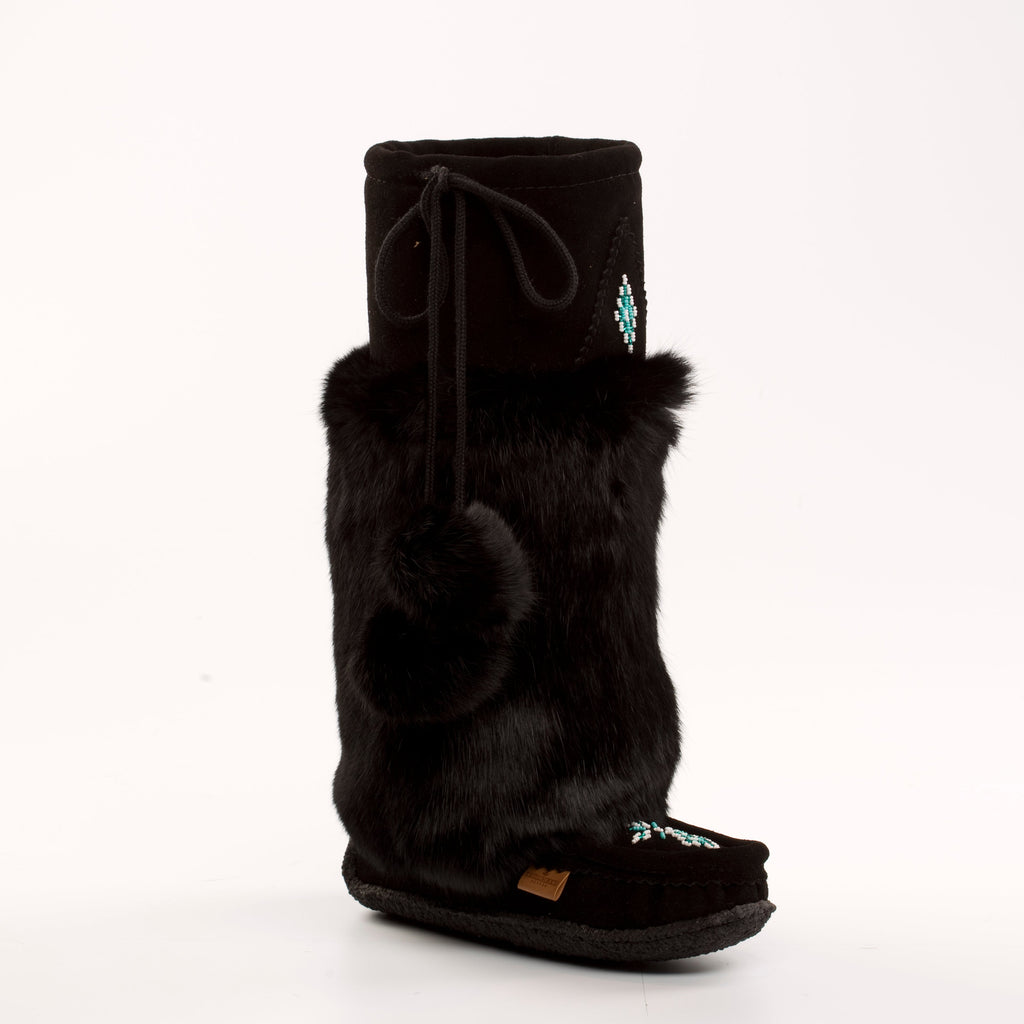 Black mukluk boot with fur trim on a white background