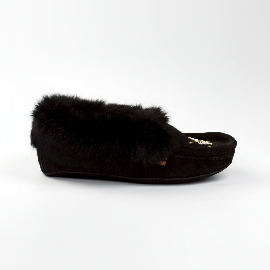 Black slipper with fur trim on a white background
