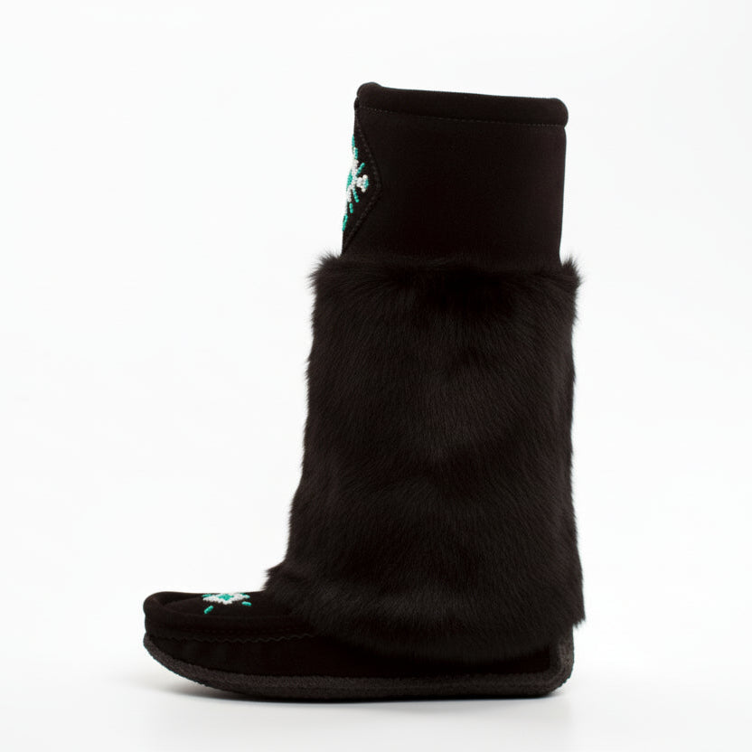 Black furry slipper boot on a white background