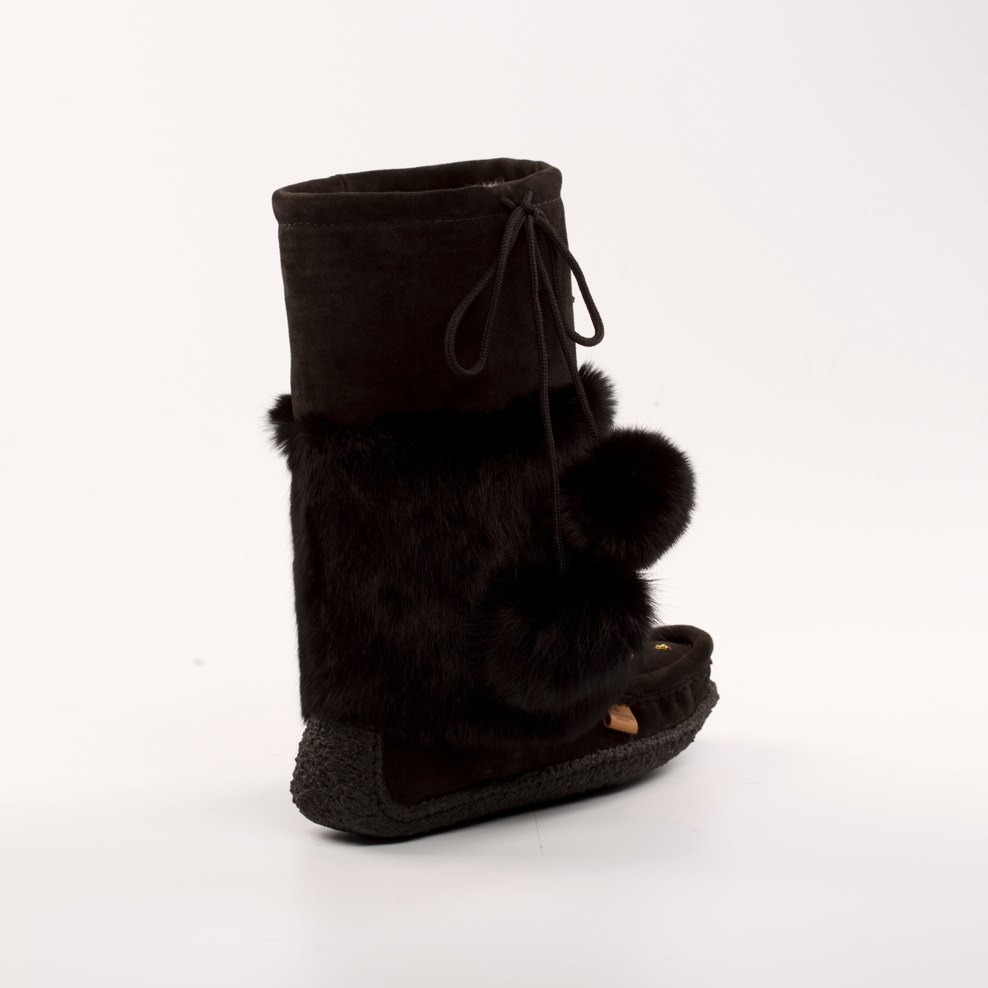 Black mukluk boot with fur trim on a white background