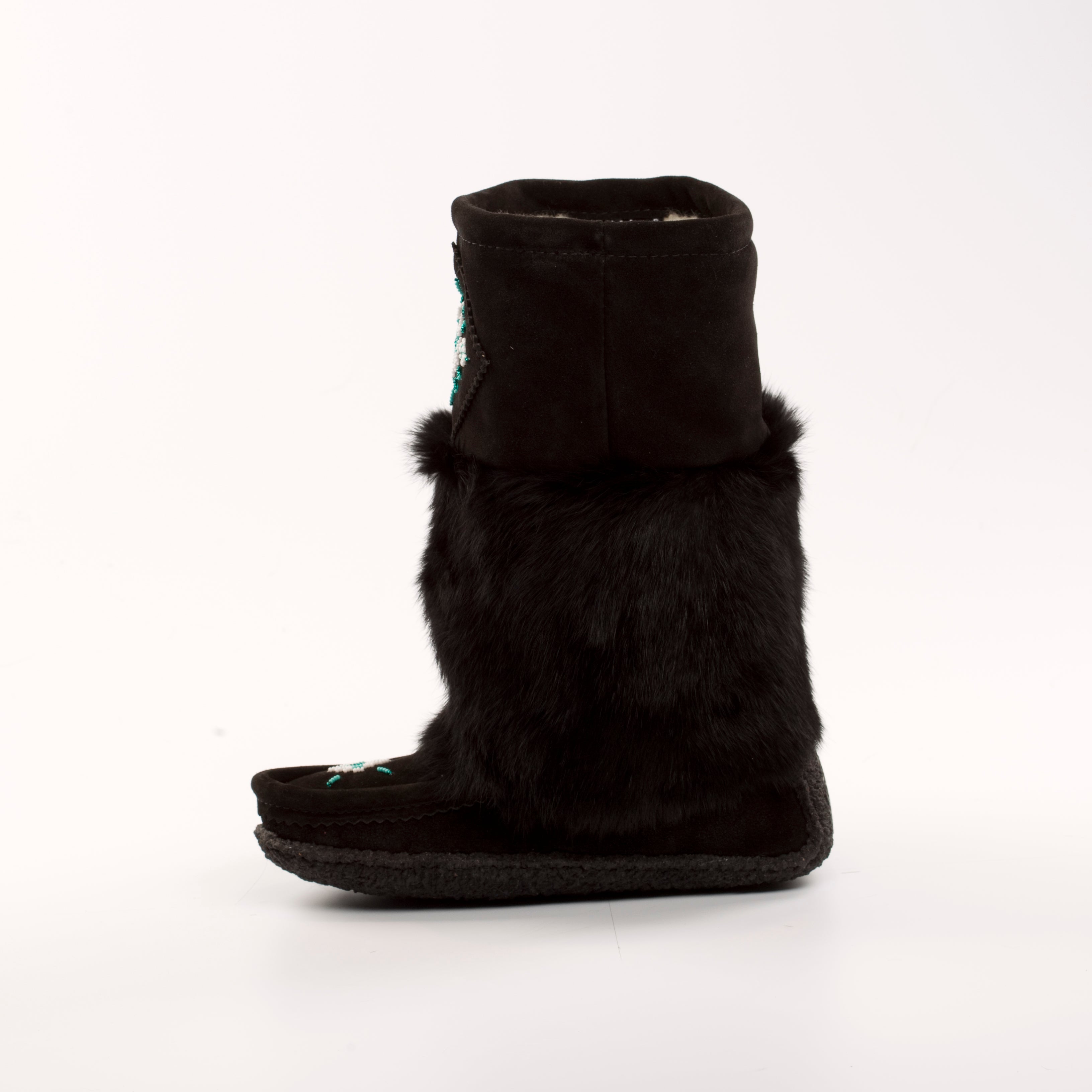 Black fur-lined mukluk boot on a white background
