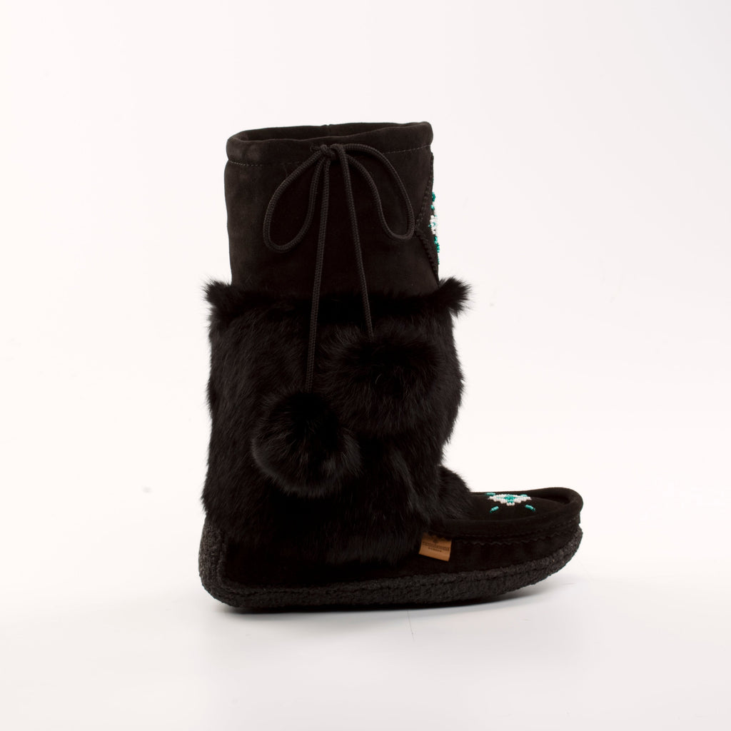 Black mukluk  boot with fur trim on a white background