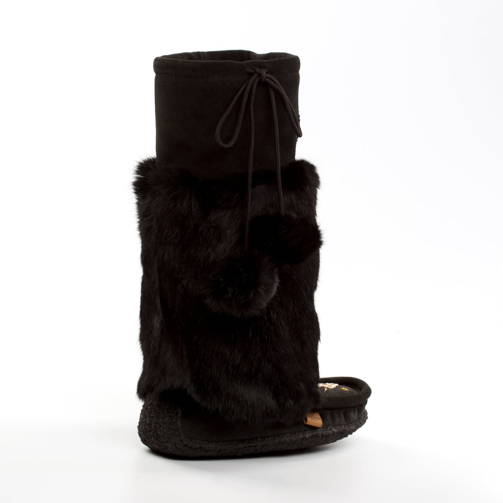 Black boot with fur trim on a white background