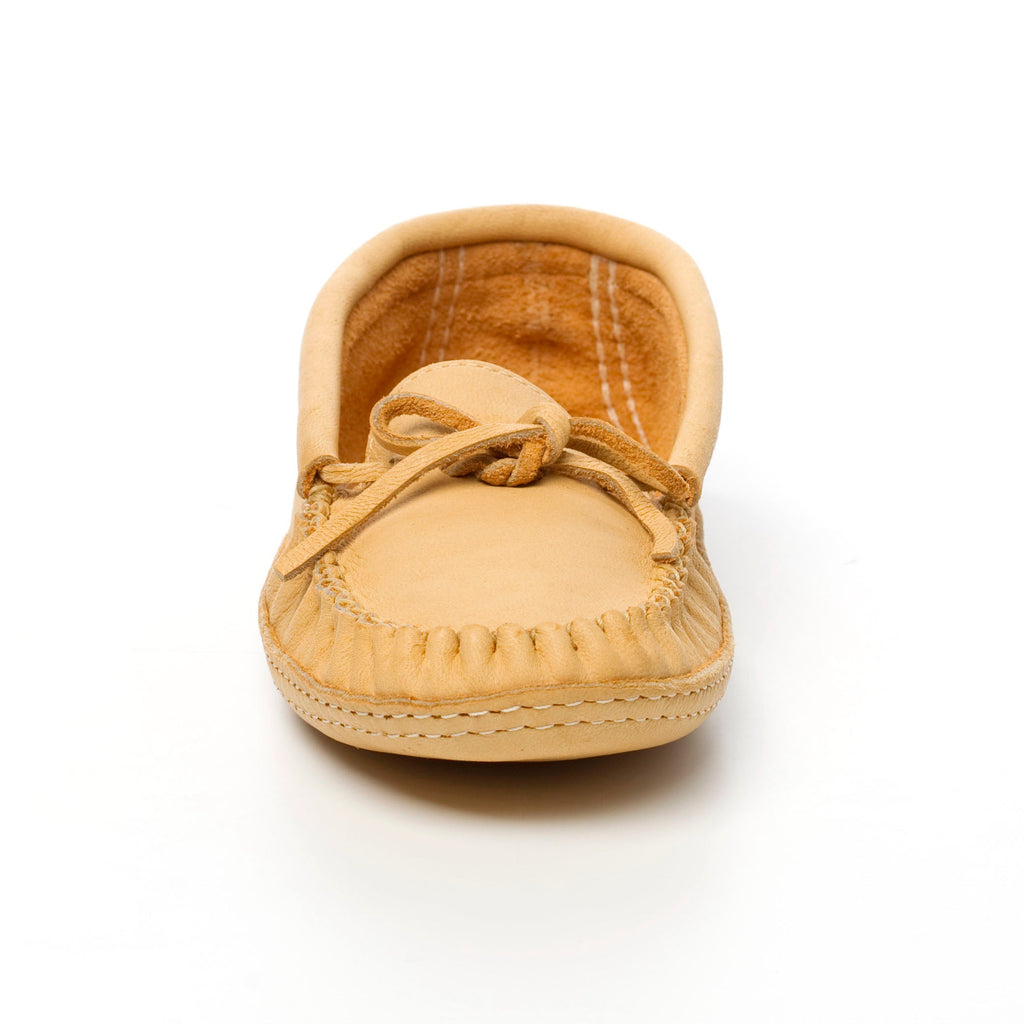 Tan baby shoe on a white background