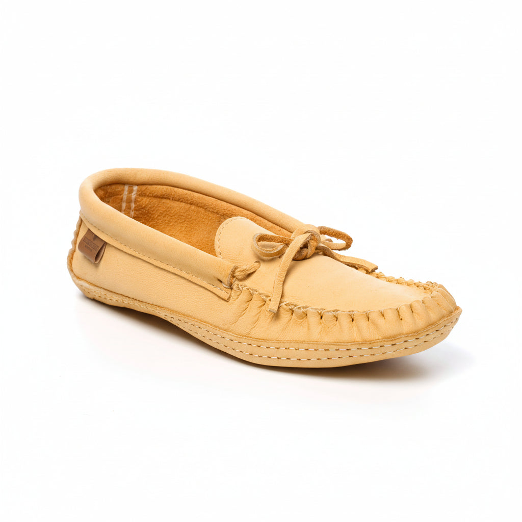 Beige moccasin shoe on a white background