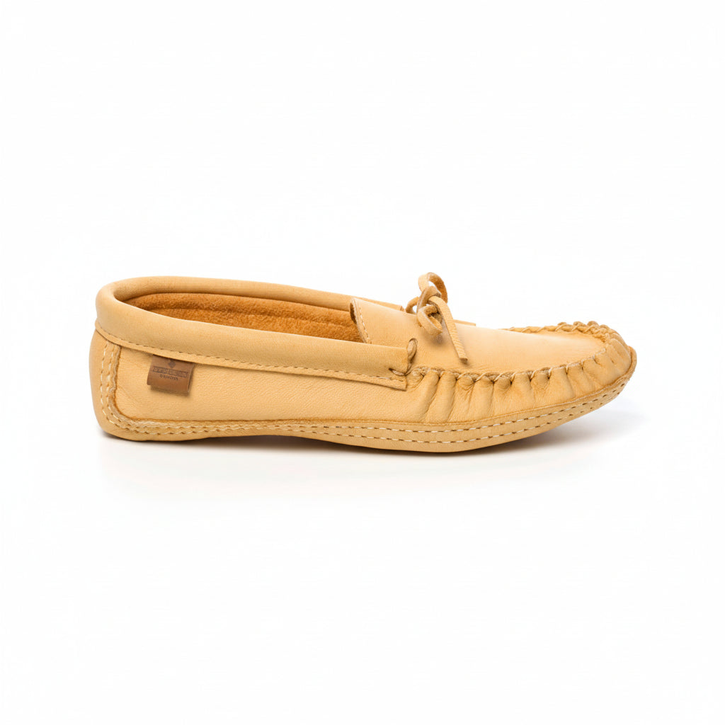 Beige moccasin shoe on a white background
