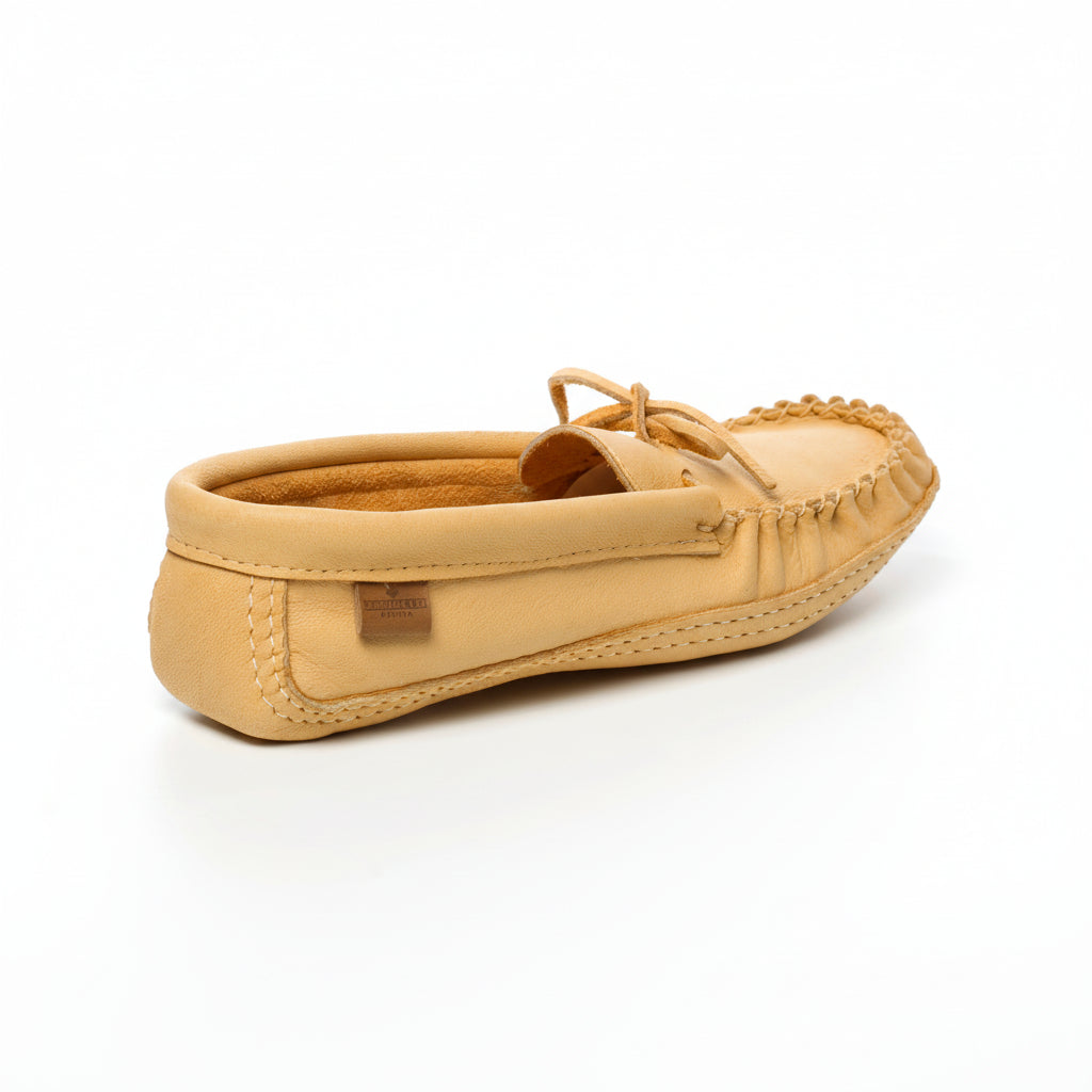 Beige moccasin shoe on a white background