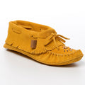 Yellow moccasin slipper with fringes on a white background