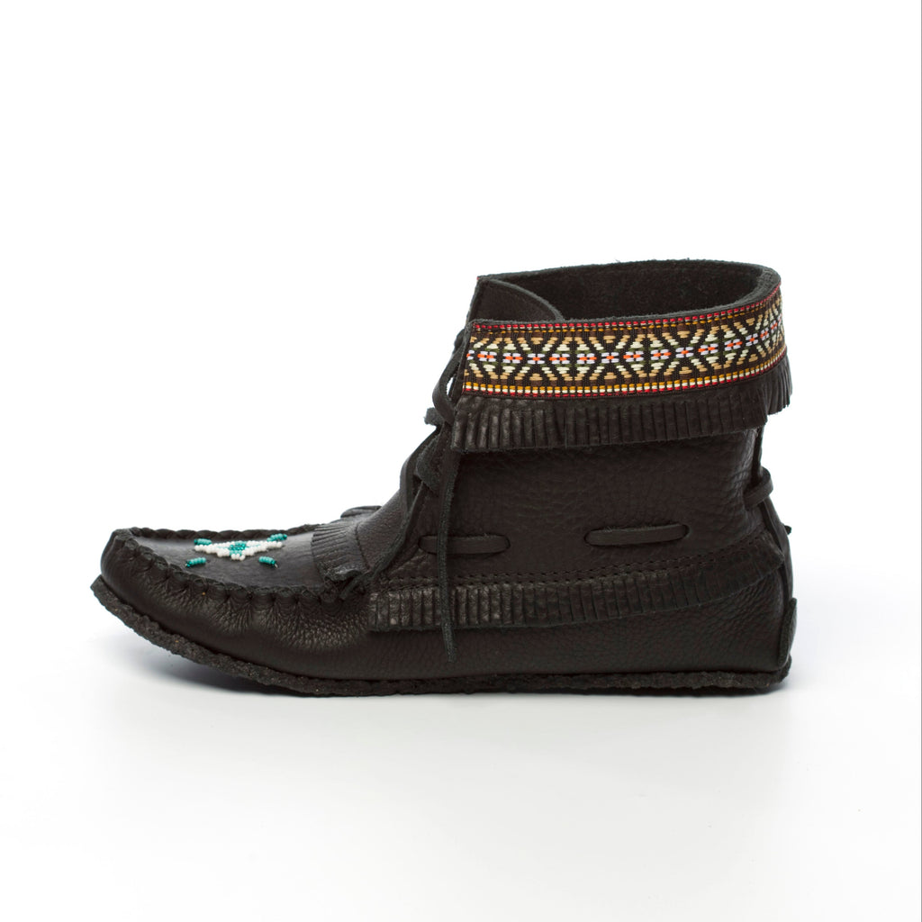 Black moccasin-style boot with decorative band on a white background