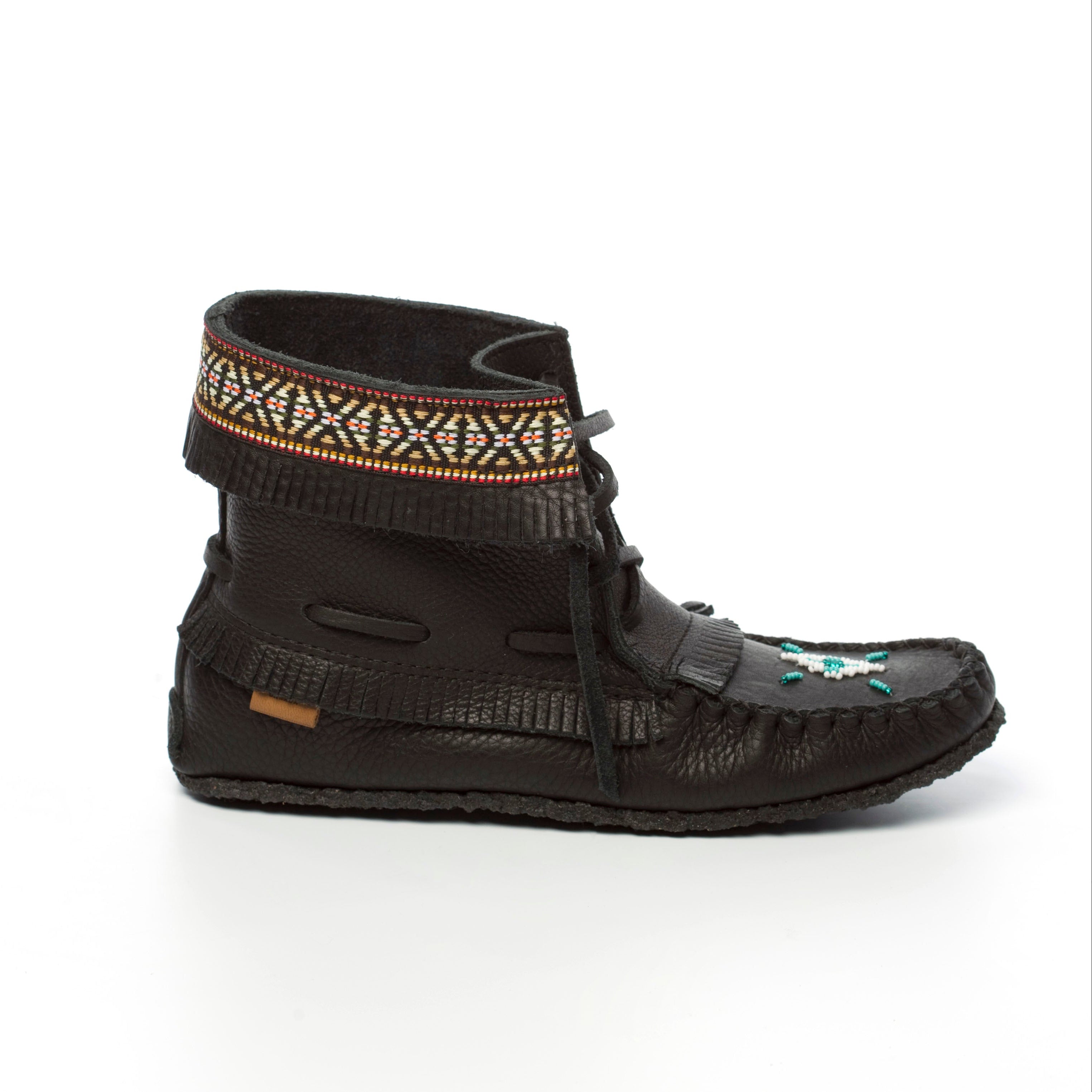 Black moccasin-style shoe with decorative band on a white background