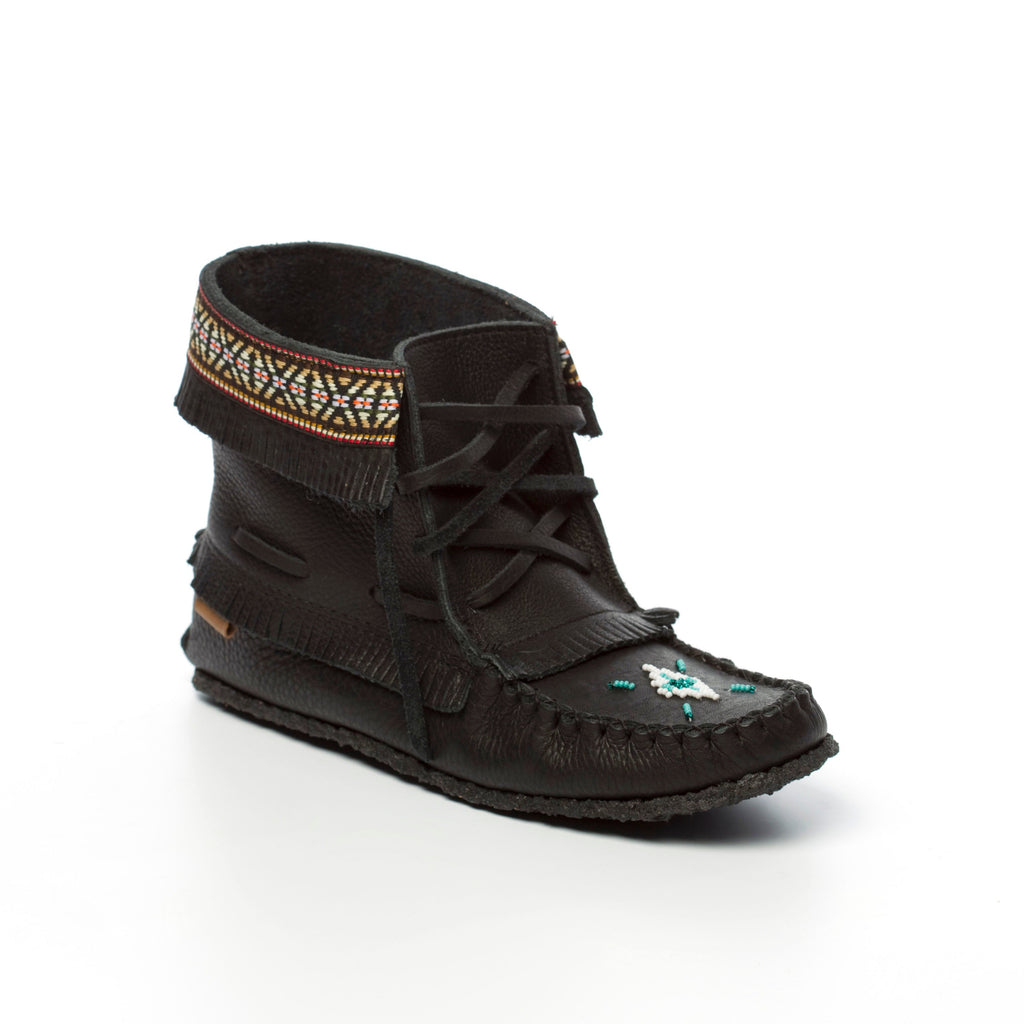 Black moccasin-style shoe with decorative elements on a white background