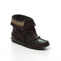 Black moccasin-style shoe with decorative elements on a white background