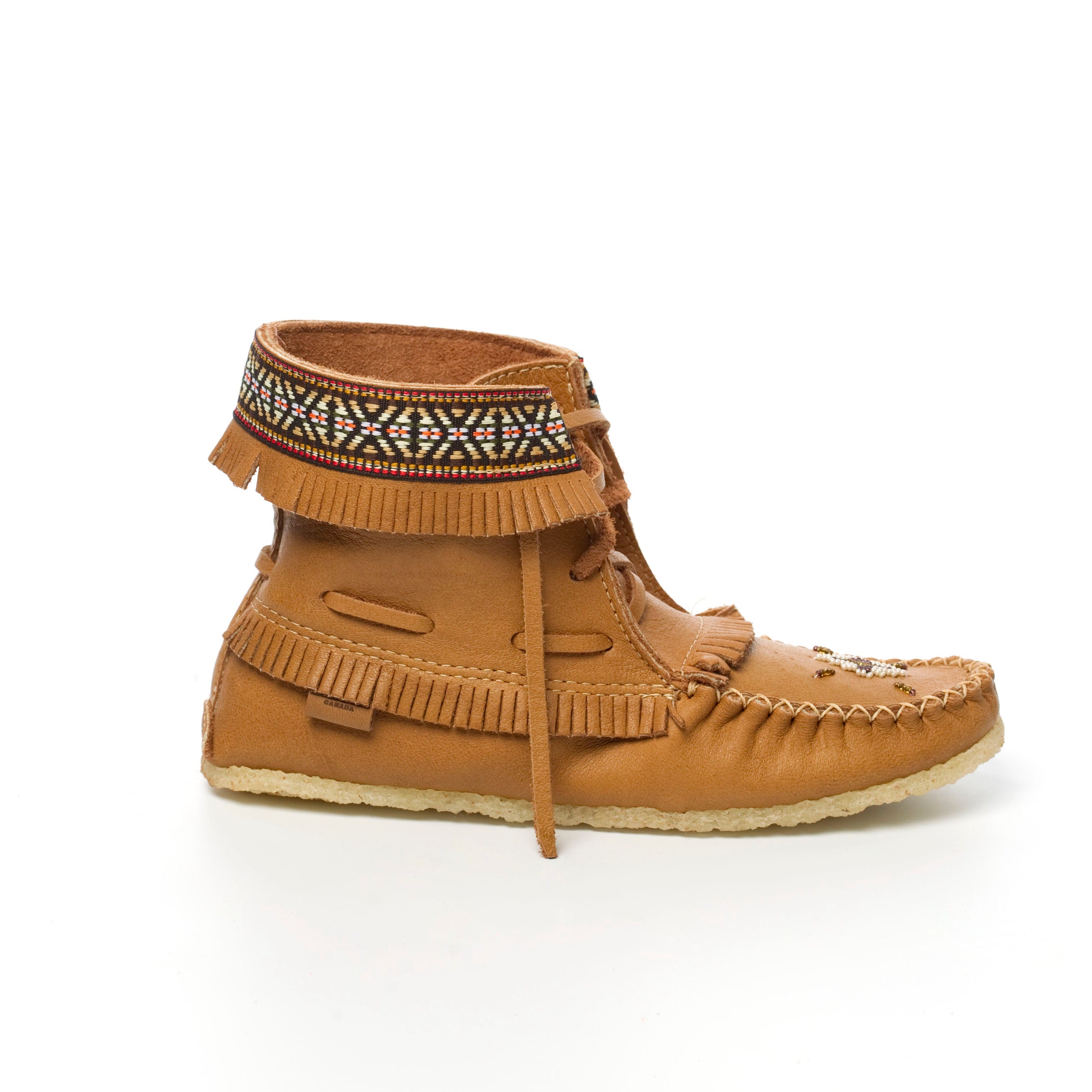 Brown moccasin shoe with decorative elements on a white background