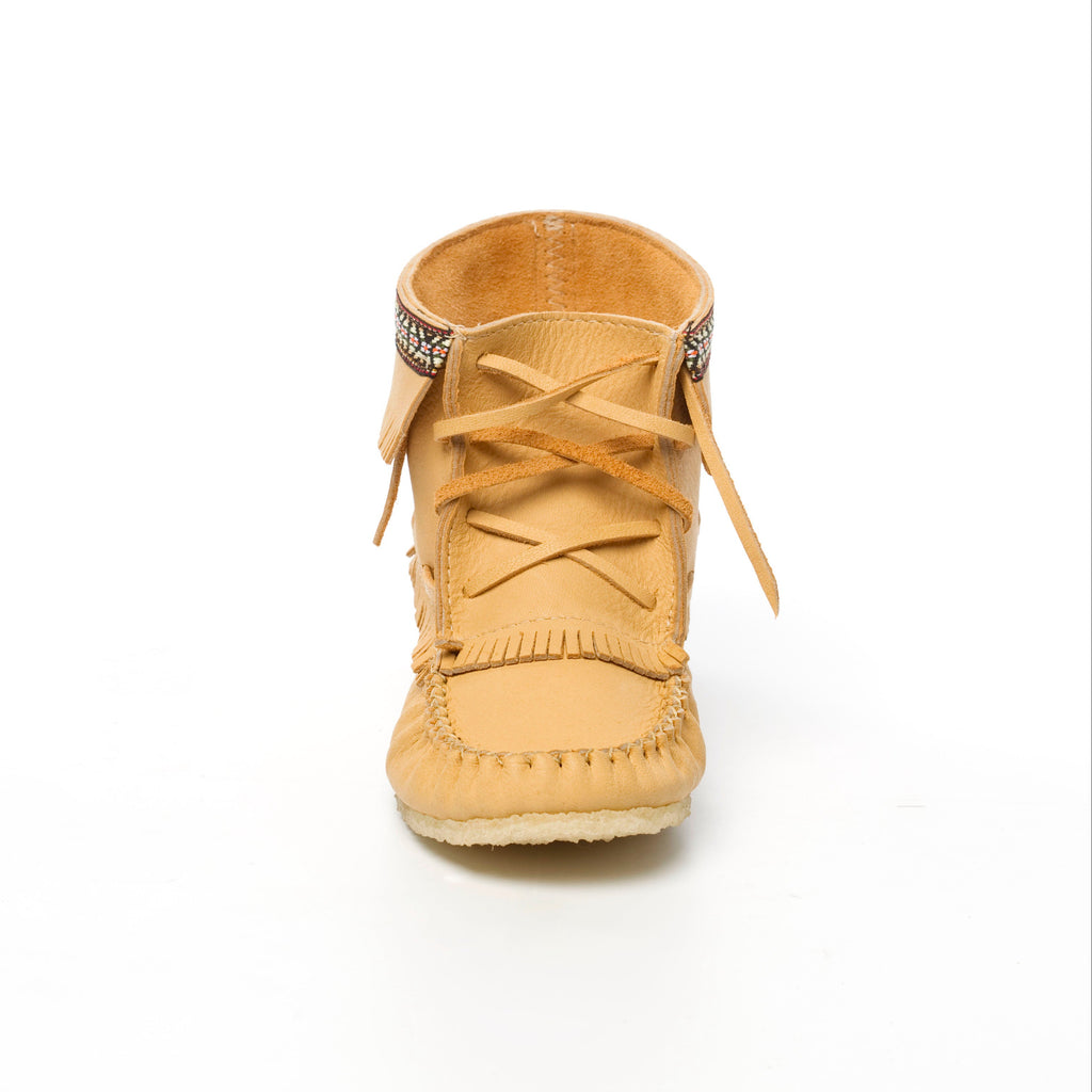 Tan moccasin-style shoe with decorative elements on a white background