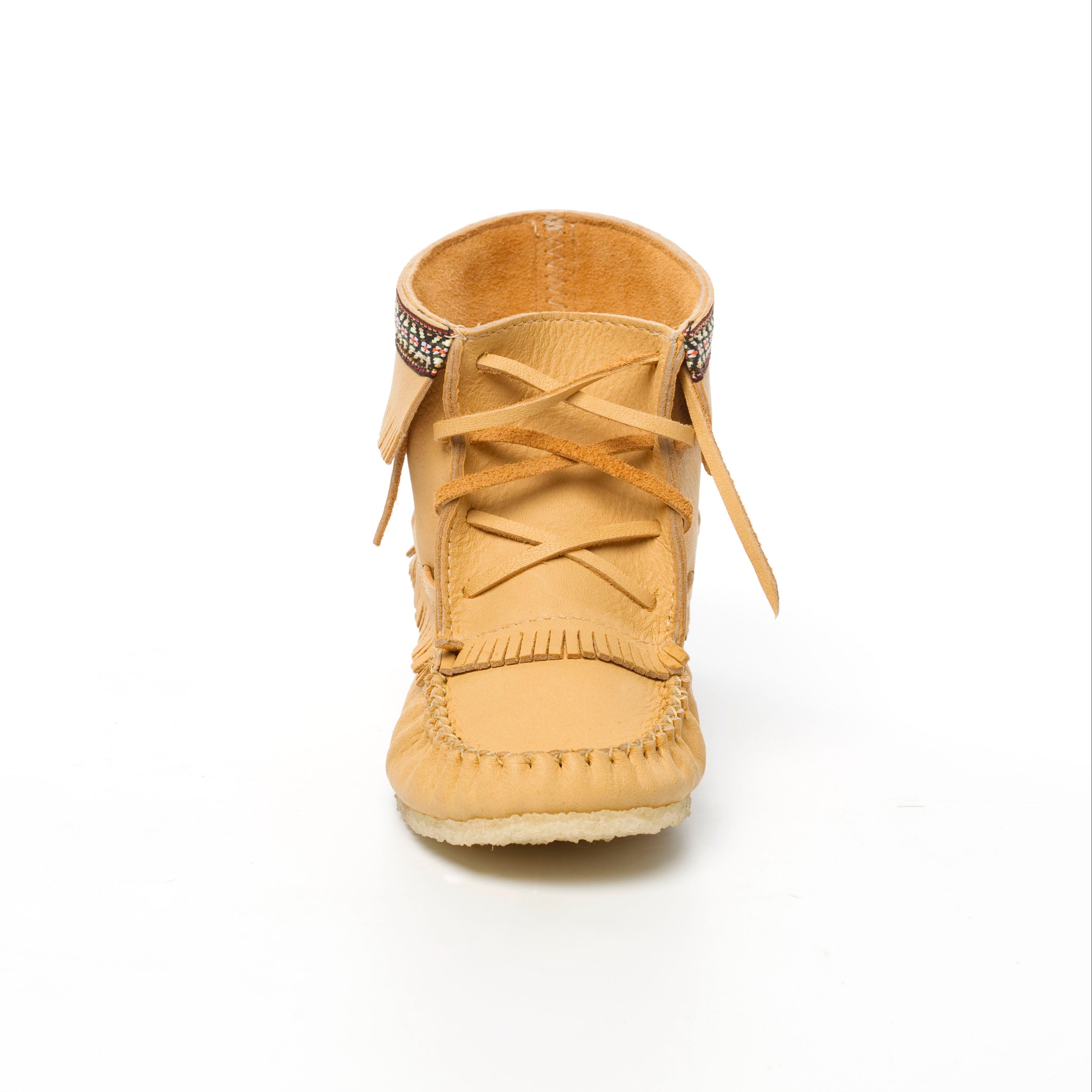Tan moccasin-style shoe with decorative elements on a white background